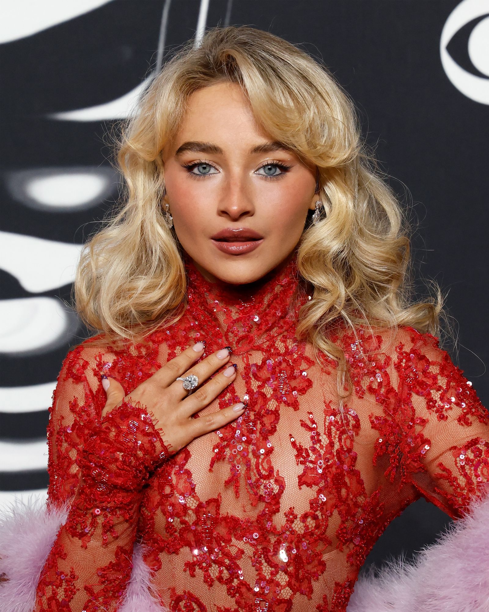 Closeup of Sabrina Carpenter with 70s feathering layers.