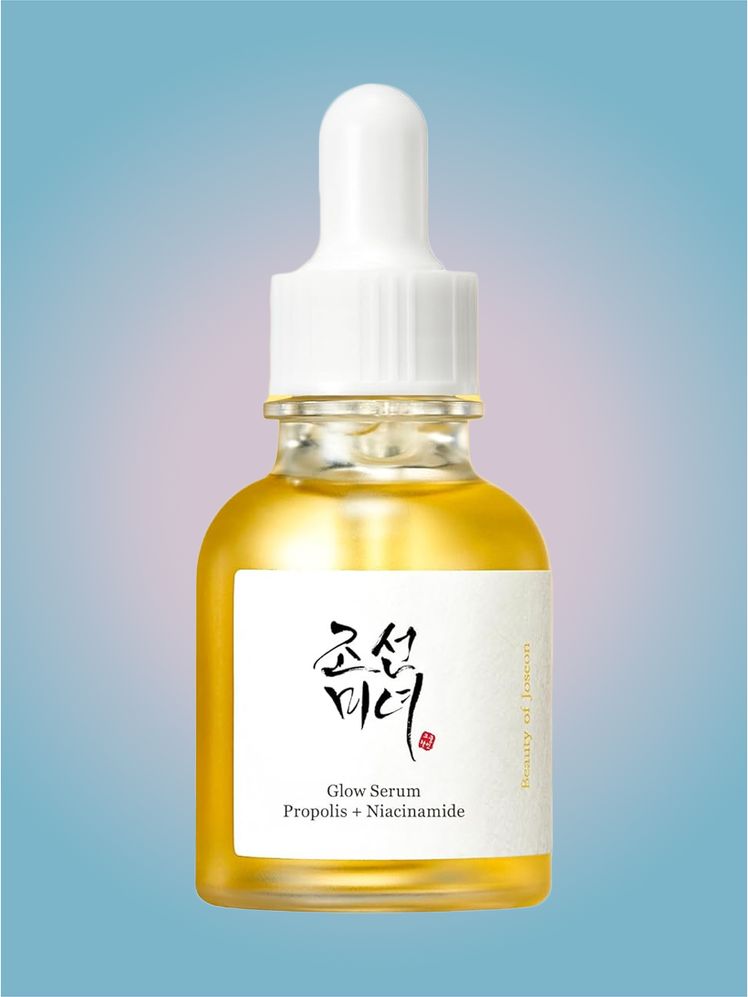 Beauty of Joseon Glow Serum in branded dropper component on a pink and blue component