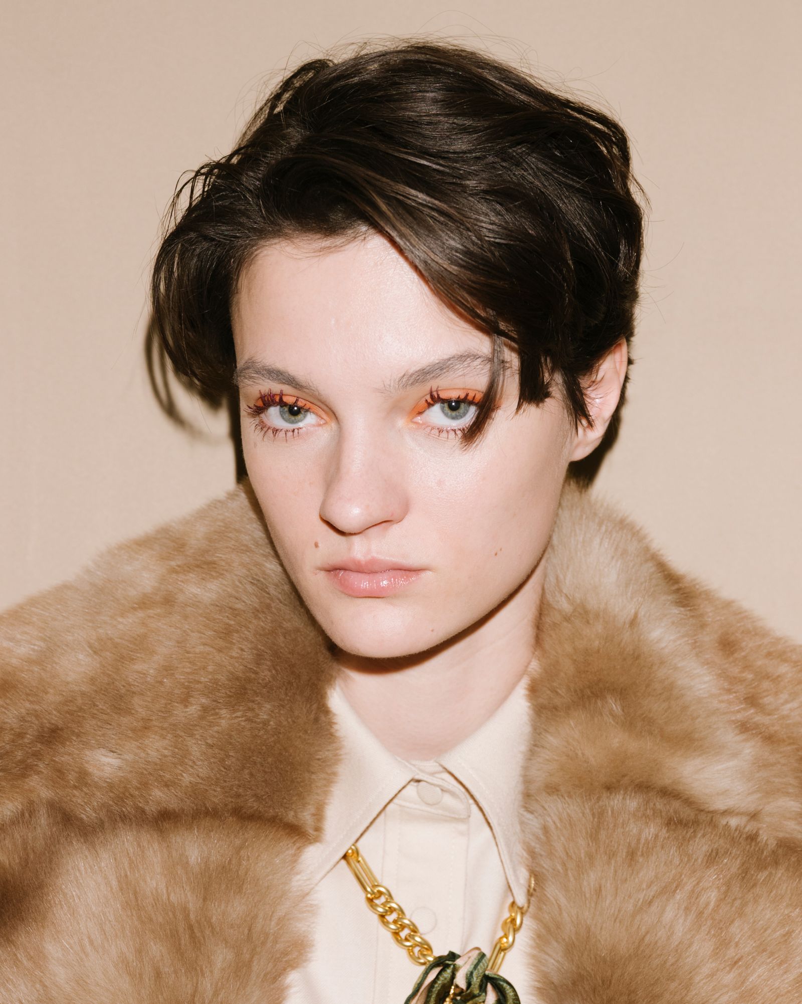 Closeup of a person with a bixie cut.