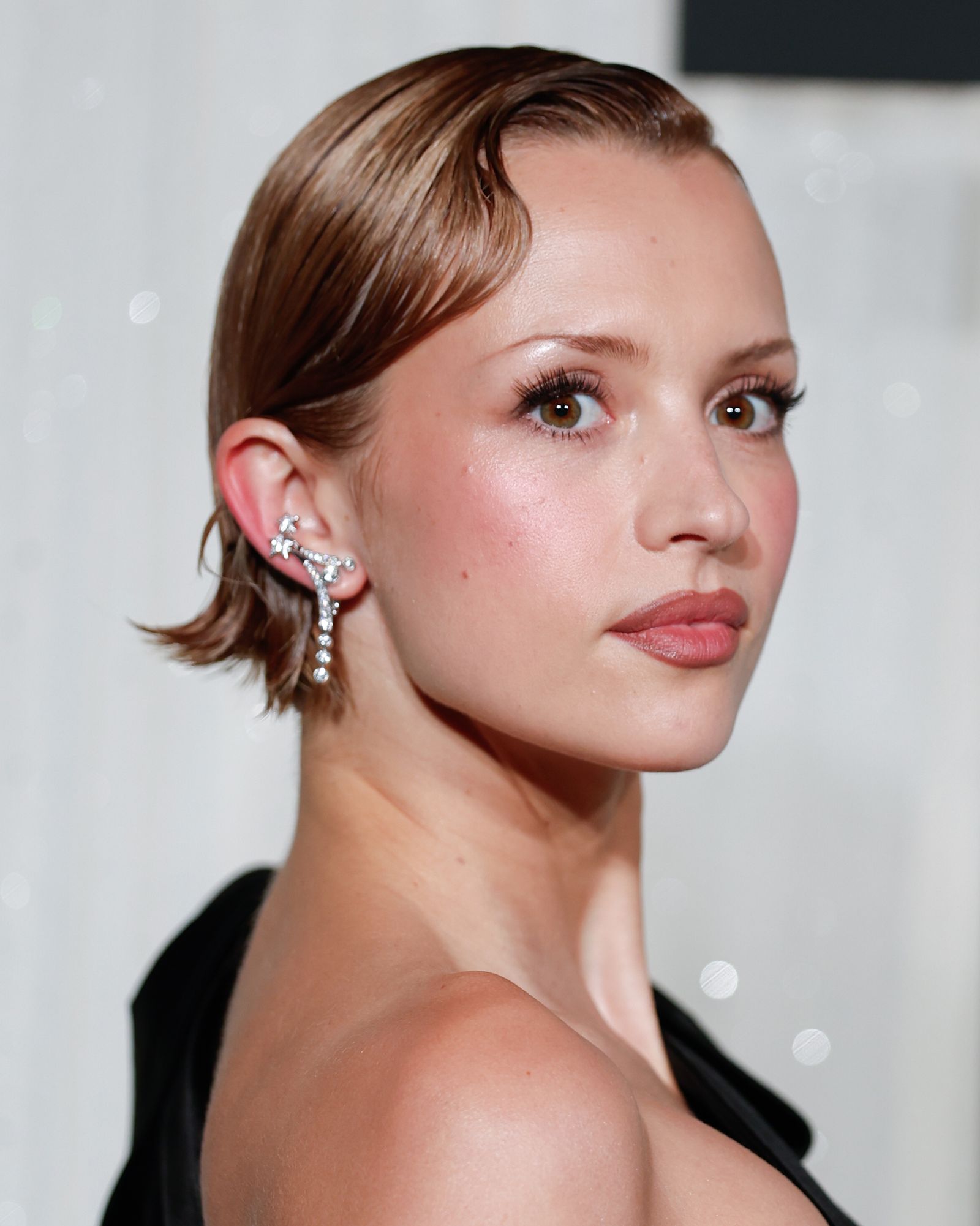 Closeup of Madison Riley with a bixie cut.