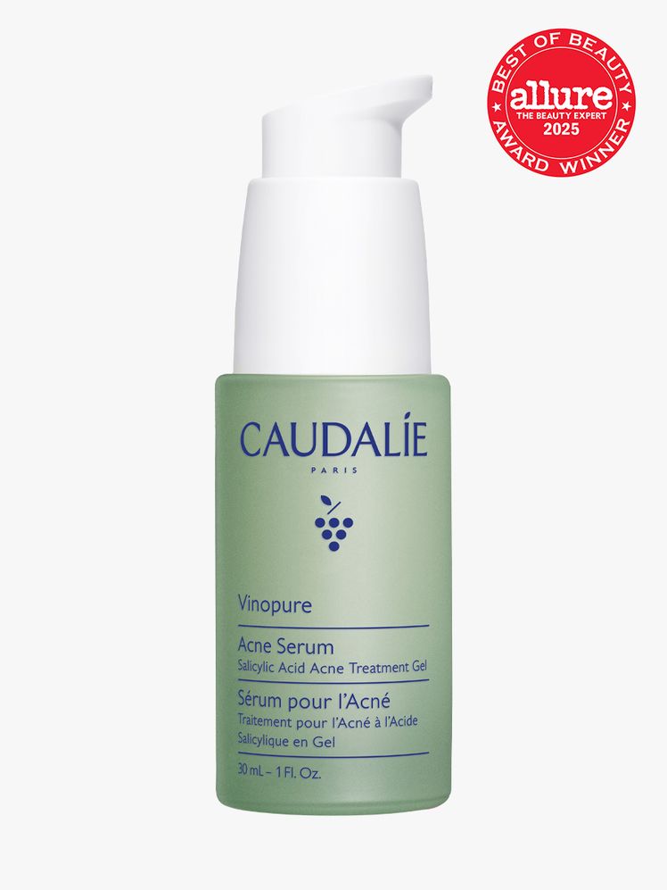 Caudalie Vinopure Acne Serum in branded green bottle with white pump on light gray background with red Allure Best of...