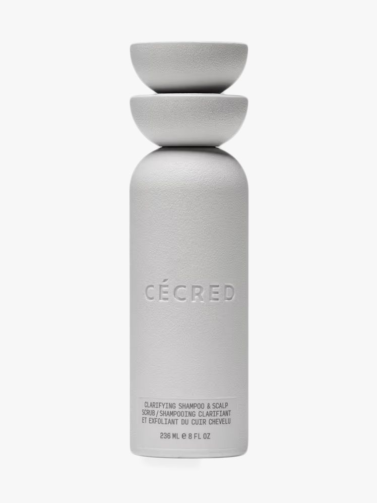 Cecréd Clarifying Shampoo + Scalp Scrub in branded component on a light gray background