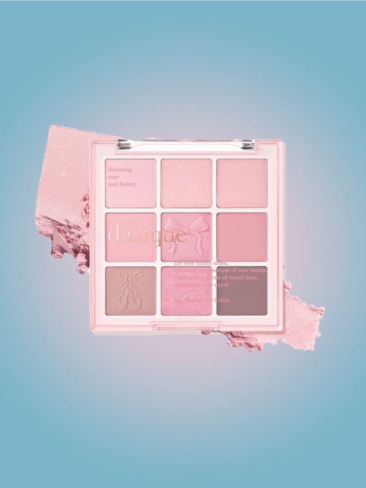 Dasique Shadow Palette pink eye shadow palette on light blue background