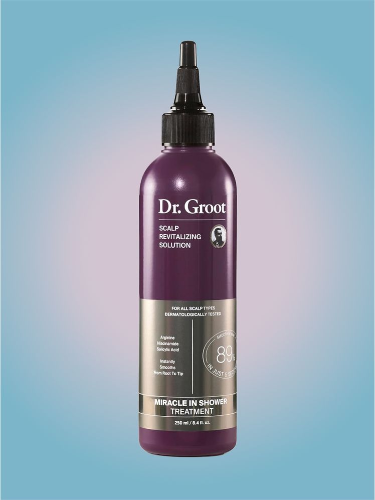 Dr. Groot Hair Miracle In Shower Treatment in branded bottle component on a pink and blue background