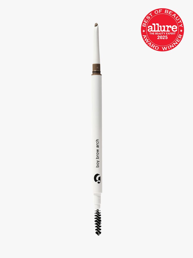 Glossier Boy Brow Arch in branded white twist up pencil applicator with brush tip on light gray background with red...