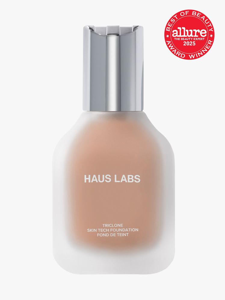 Haus Labs Triclone Skin Tech Medium Coverage Foundation in frosted glass bottle with silver cap on light gray background...