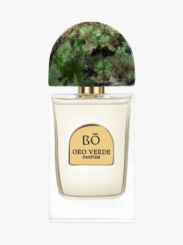 Oro Verde Parfum clear bottle with green top on light grey background