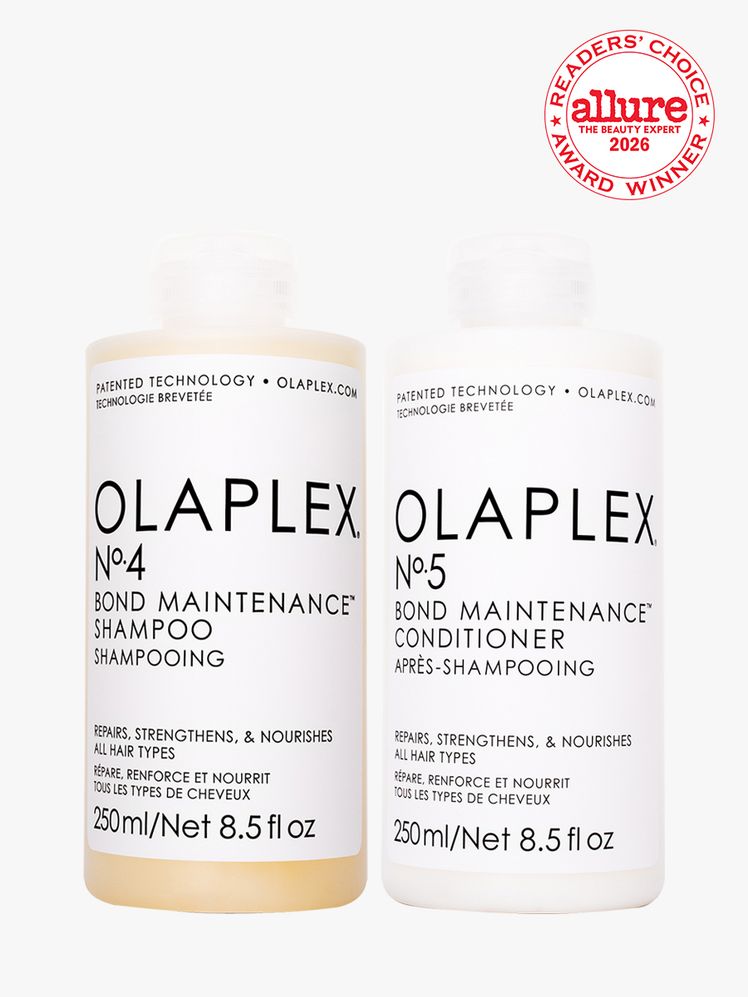 Bottle of OLAPLEX shampoo and conditioner on white background