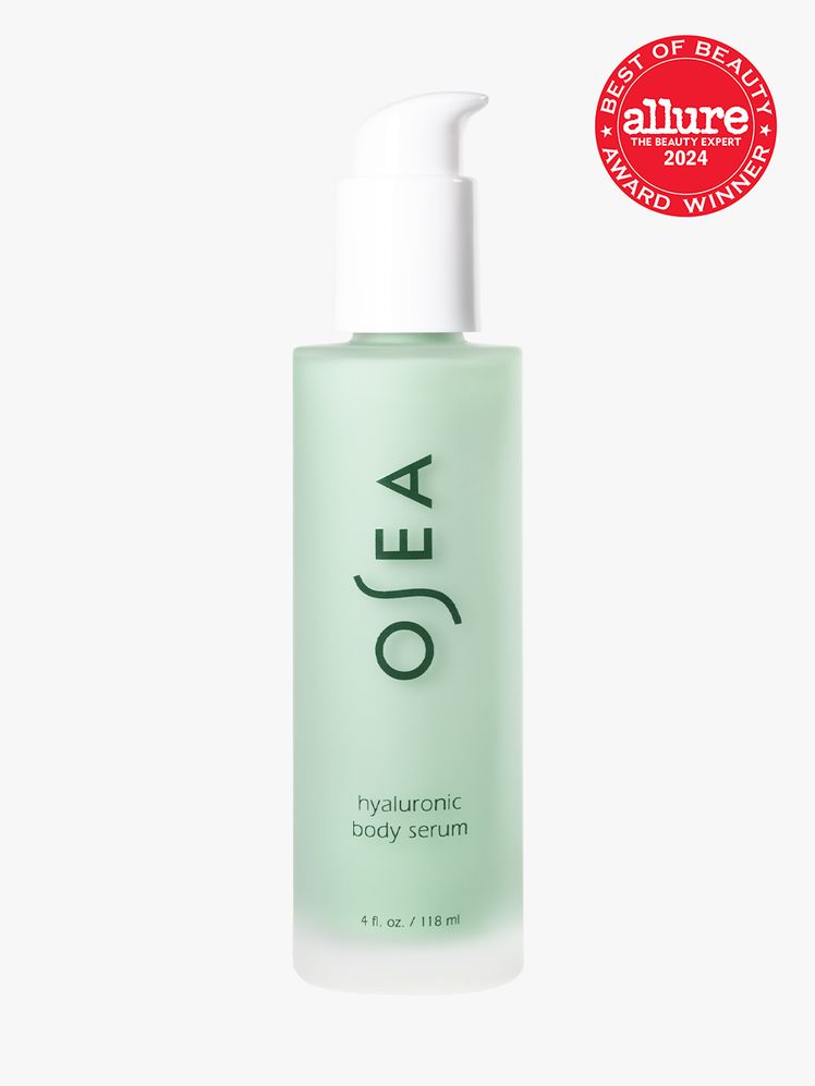 body serum in branded clear bottle with white pump on light gray background with red and white 2024 allure best of...