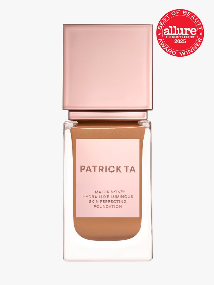 Major Skin HydraLuxe Luminous Skin Perfecting Foundation in clear glass bottle with rose gold cap on light gray...