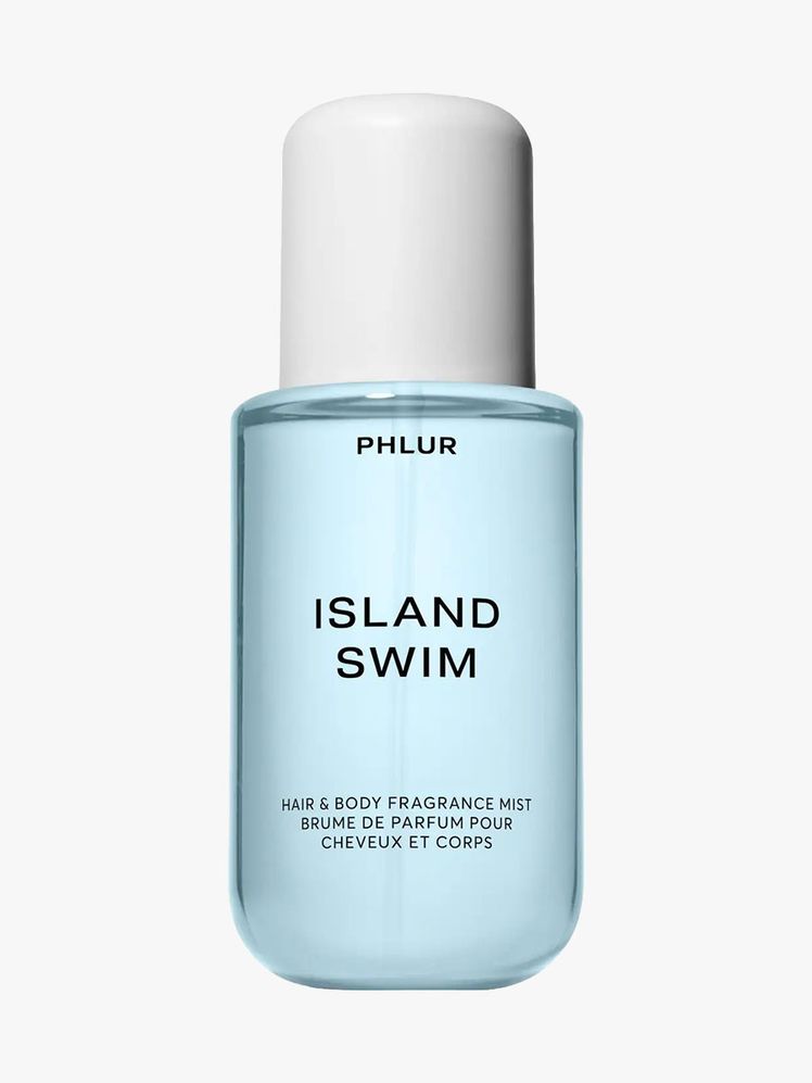 Phlur Island Swim Body Mist light blue and white bottle on light gray background