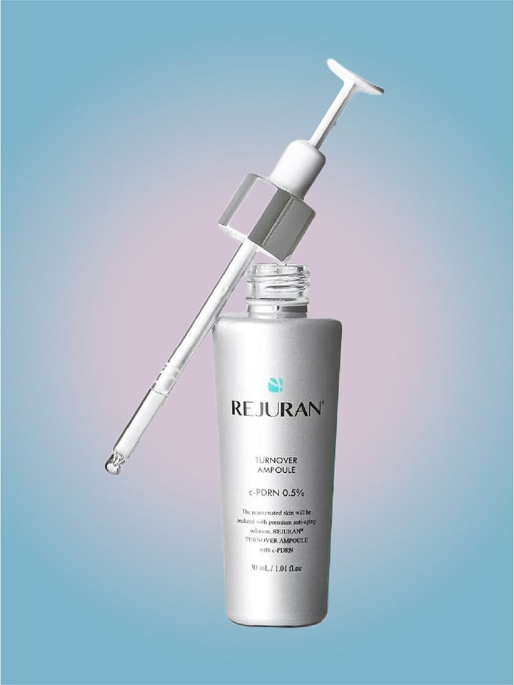 Rejuran Turnover Ampoule in branded component on a pink and blue background