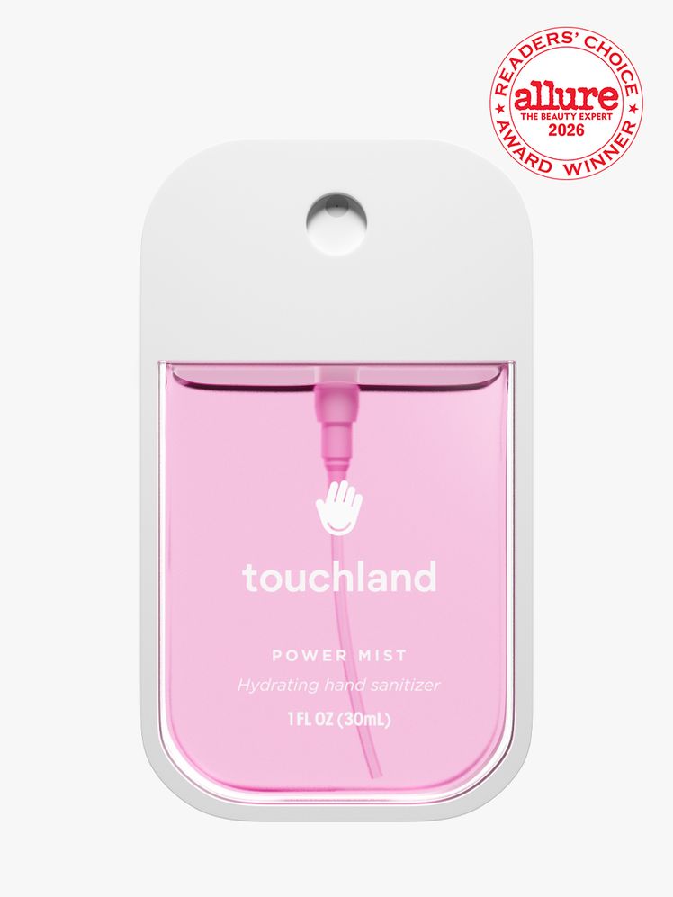 Container of Touchland Power Mist on white background