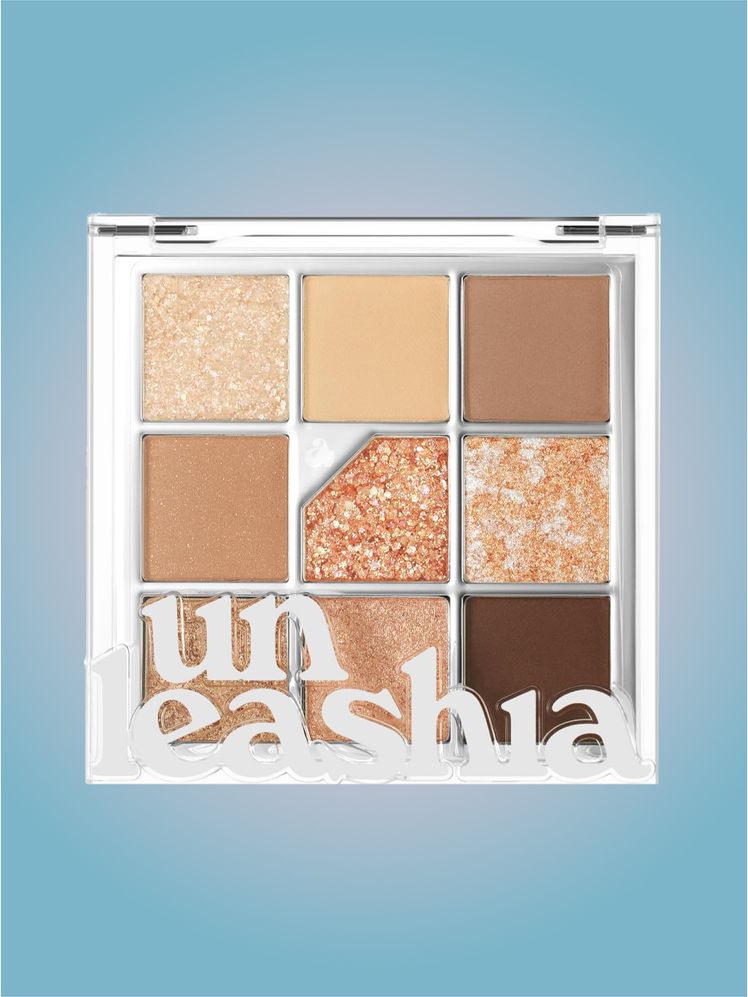 Unleashia Glitter Eye Palette in branded component on a pink and blue background