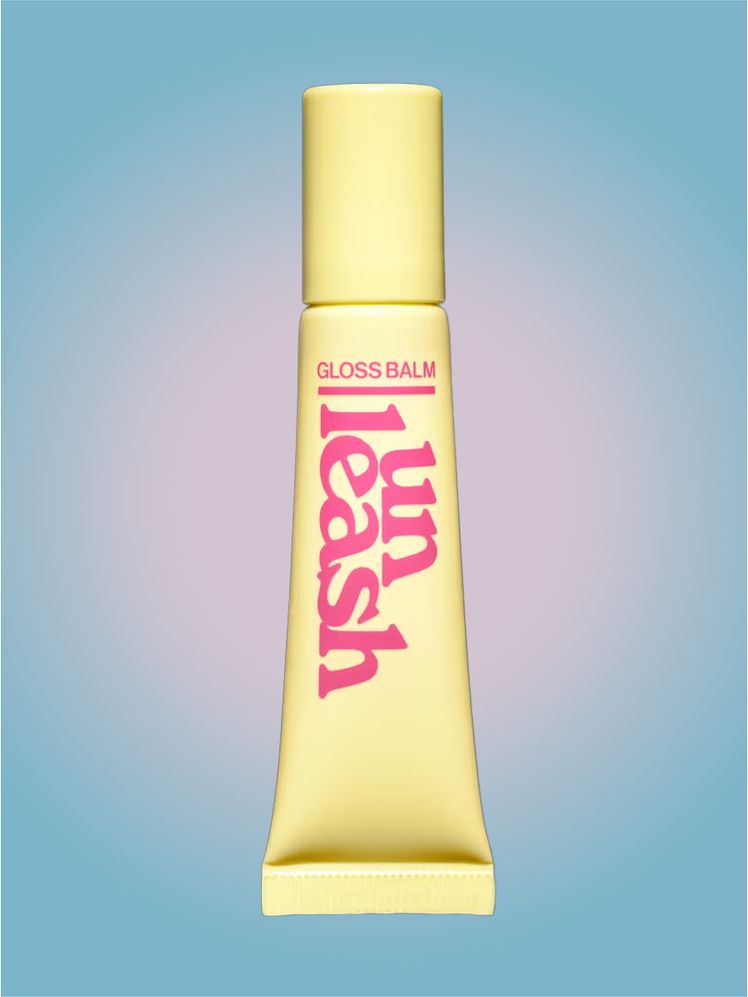 Unleashia Sunset Dazzle Gloss Balm in branded tube component on a pink and blue background