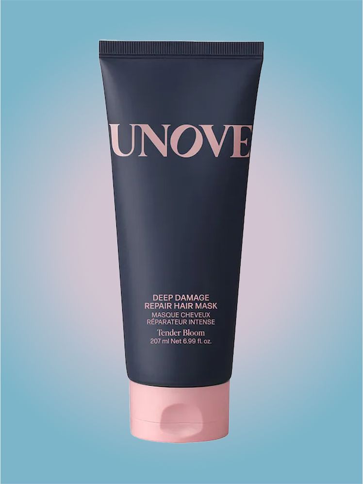 Unove Deep Damage Treatment EX in branded tube component on a pink and blue background