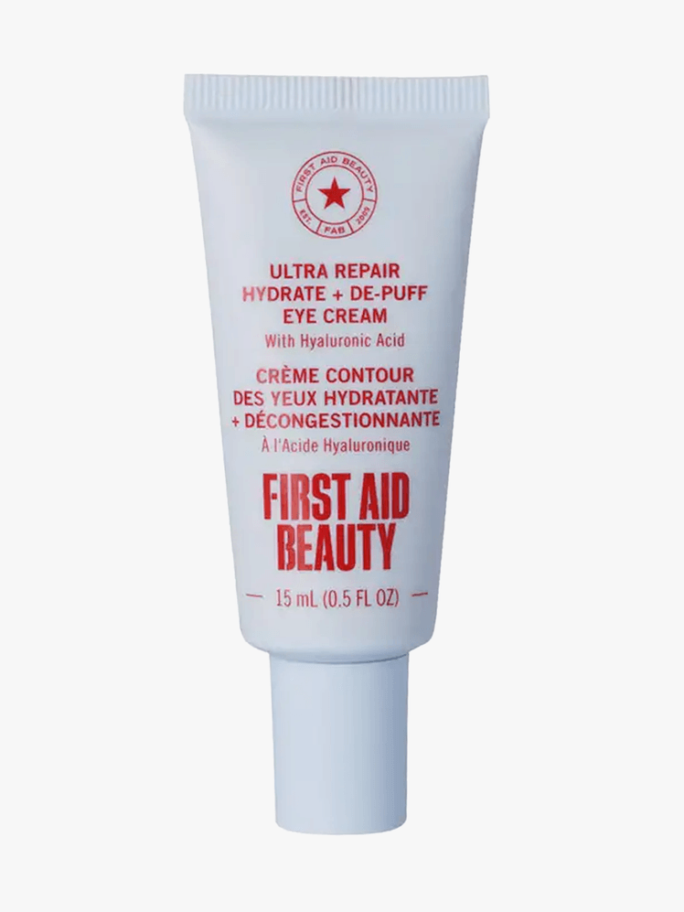 First Aid Beauty Ultra Repair Eye Cream in branded tube component on a light gray background